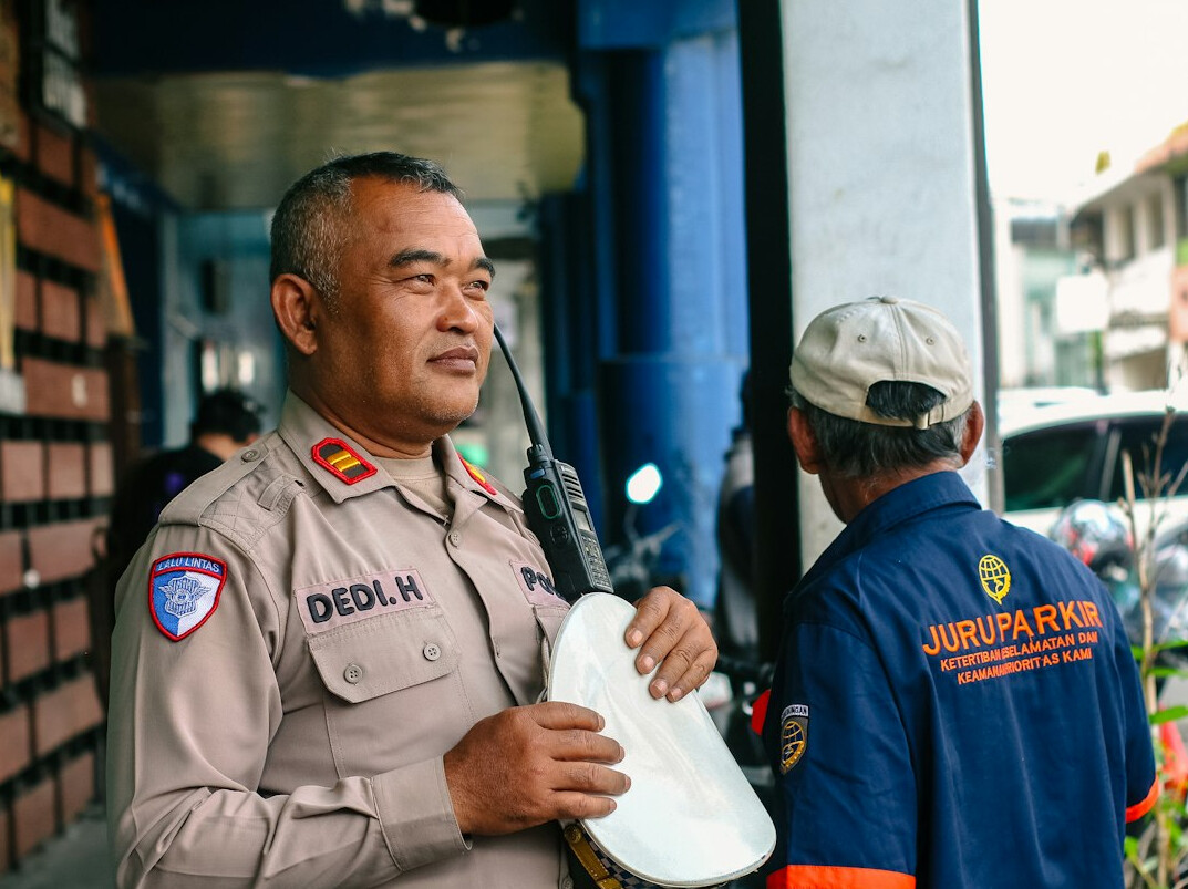 security guard talking to customer