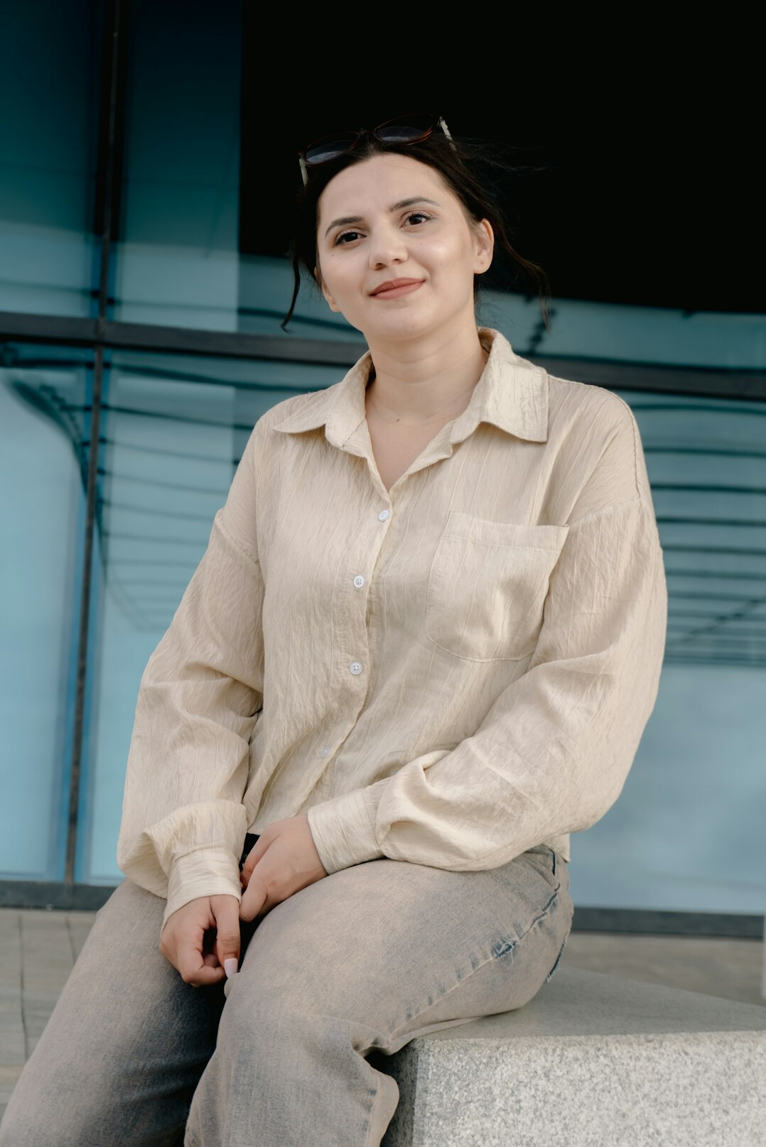 Portrait of a smiling woman editor in a bright room